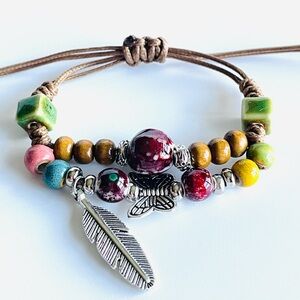 Artisan Multicolor Beaded Bracelet with Feather Charm